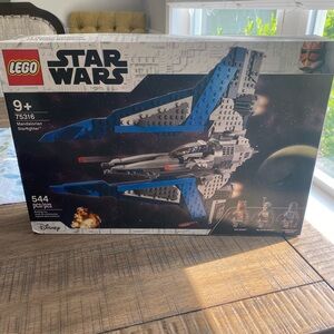 Legos Mandalarion Starfighter. Brand new. Never opened. Retail on Amazon for $96